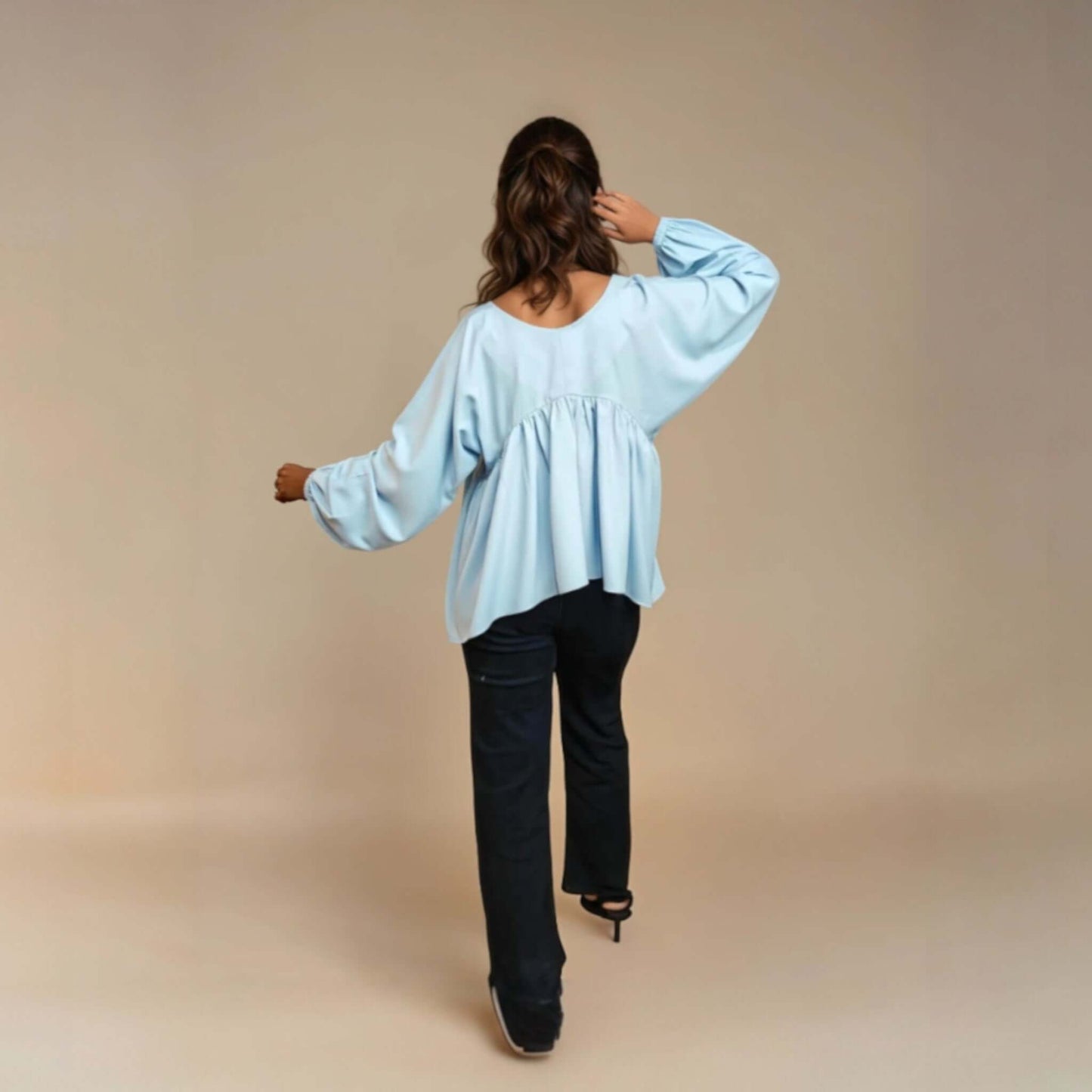 Model wearing a light blue Charming Flare Top, showcasing its flared design and scoop neckline from house of majisha, perfect for casual outings and summer brunches.