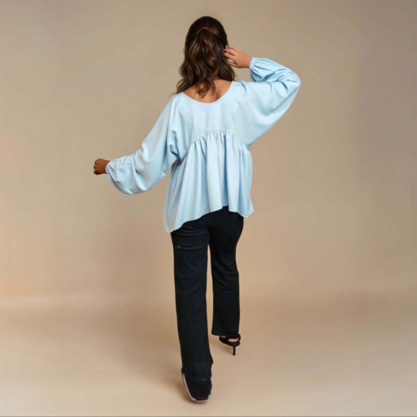 Model wearing a light blue Charming Flare Top, showcasing its flared design and scoop neckline from house of majisha, perfect for casual outings and summer brunches.