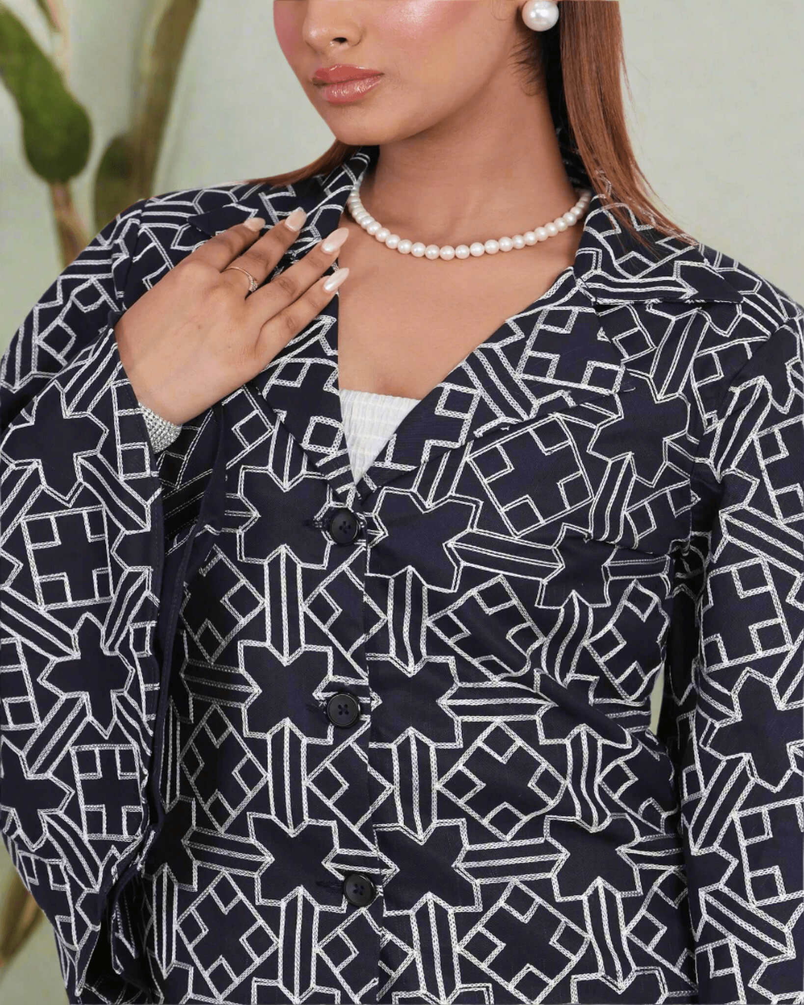 Dark blue embroidered fusion wear set for women featuring intricate thread work, bell sleeves, and tailored pants - a perfect blend of traditional craftsmanship and modern style.