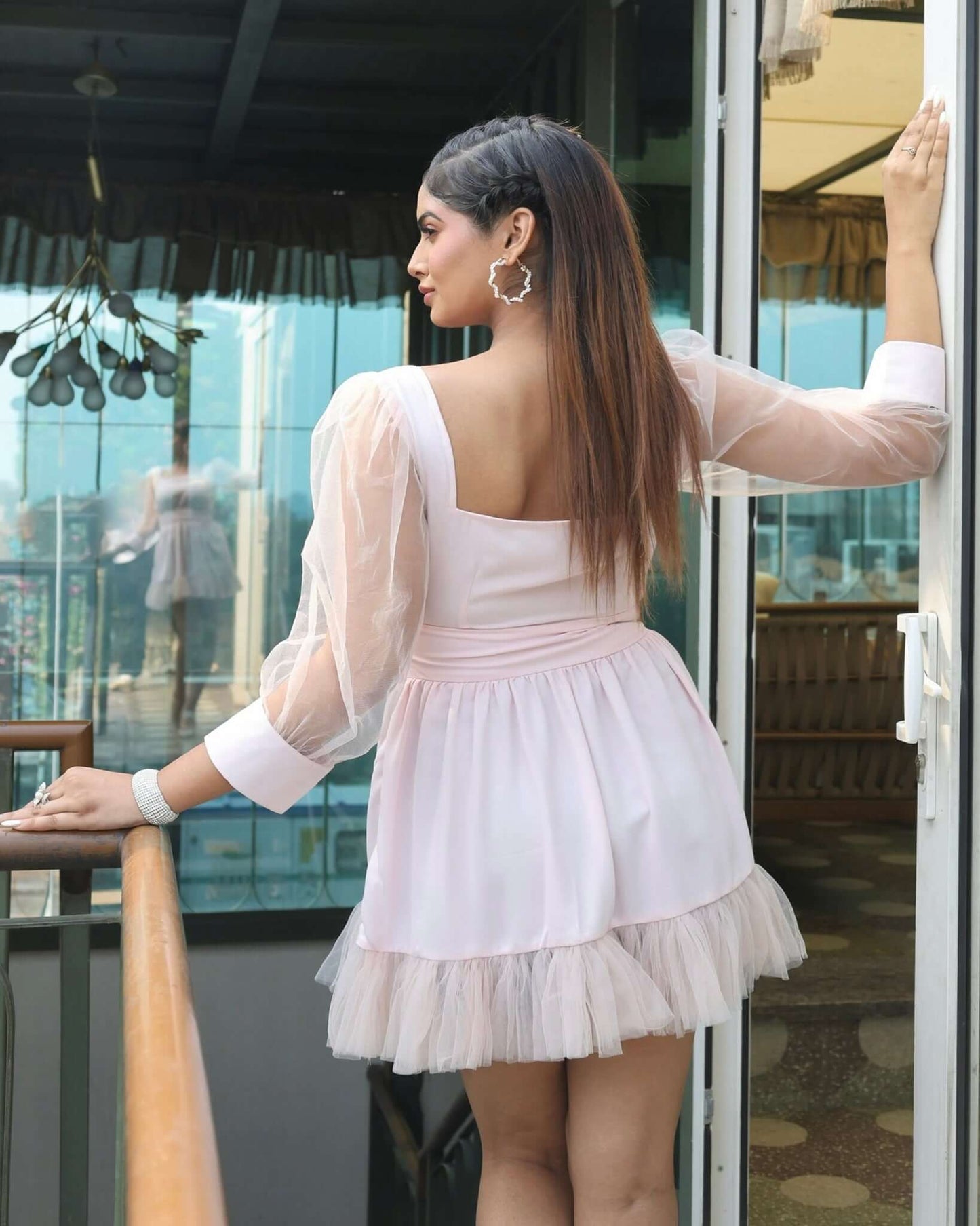 Stylish women's Tulle Ruffle Dress with layered tulle skirt and puffy sheer sleeves, perfect for elegant occasions.