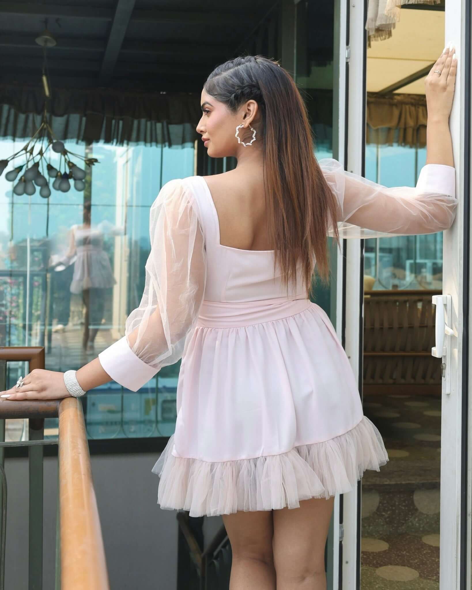 Stylish women's Tulle Ruffle Dress with layered tulle skirt and puffy sheer sleeves, perfect for elegant occasions.