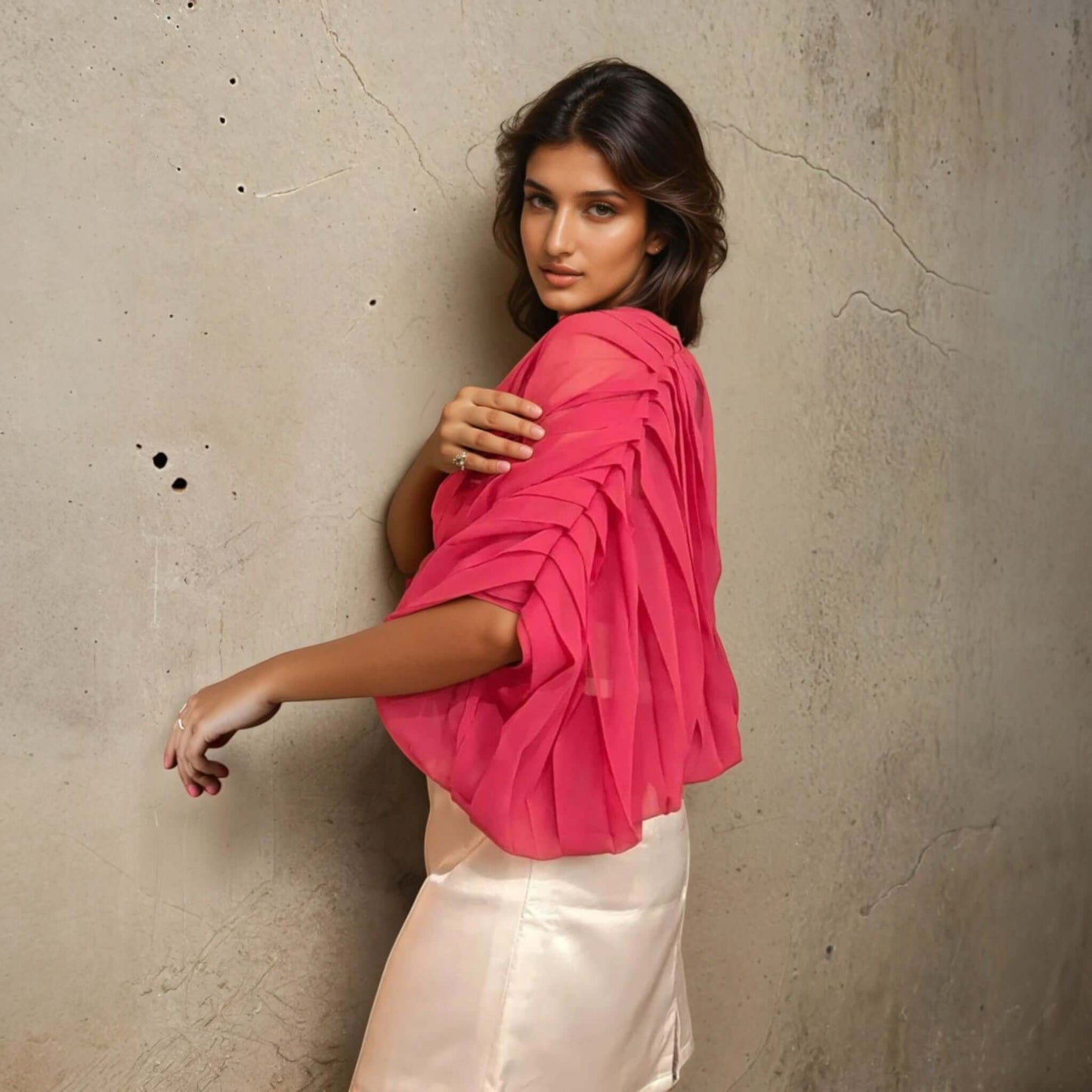 Model showcasing House Of Majisha Fabulous Fuchsia Top made of Georgette and Satin with pleat detailing, perfect for casual outings and parties.