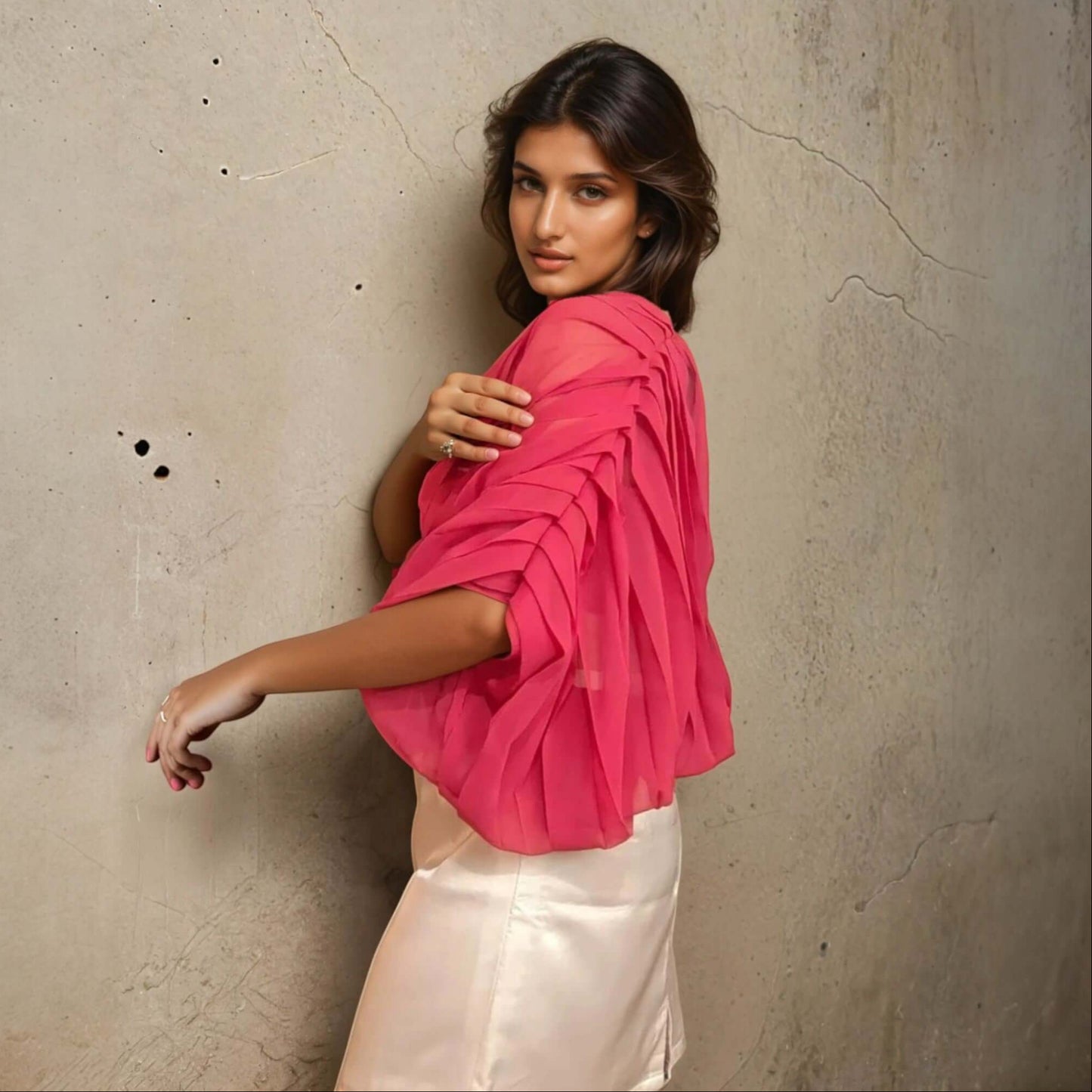 Model showcasing House Of Majisha Fabulous Fuchsia Top made of Georgette and Satin with pleat detailing, perfect for casual outings and parties.