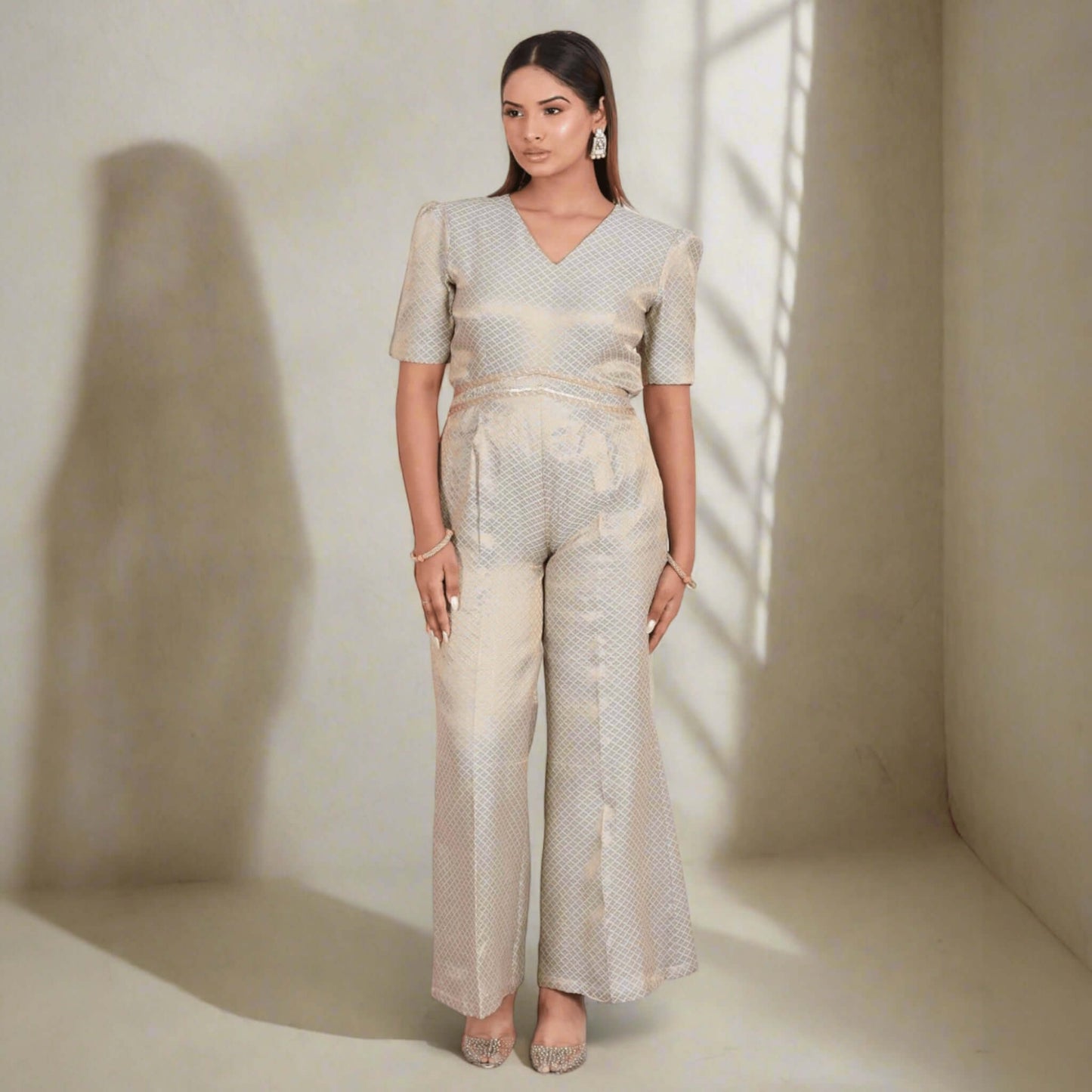Exquisite brocade jumpsuit in soft gold with chic Indo-Western style, V-neckline, and short sleeves - perfect for festive occasions and parties.