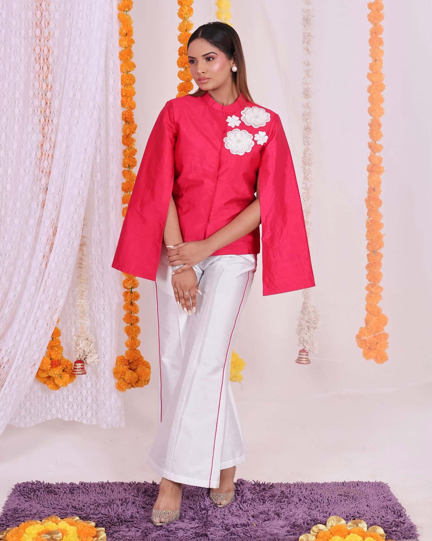 Stylish pink floral patch jacket and white pants set for women, perfect for festive occasions and elegant gatherings.