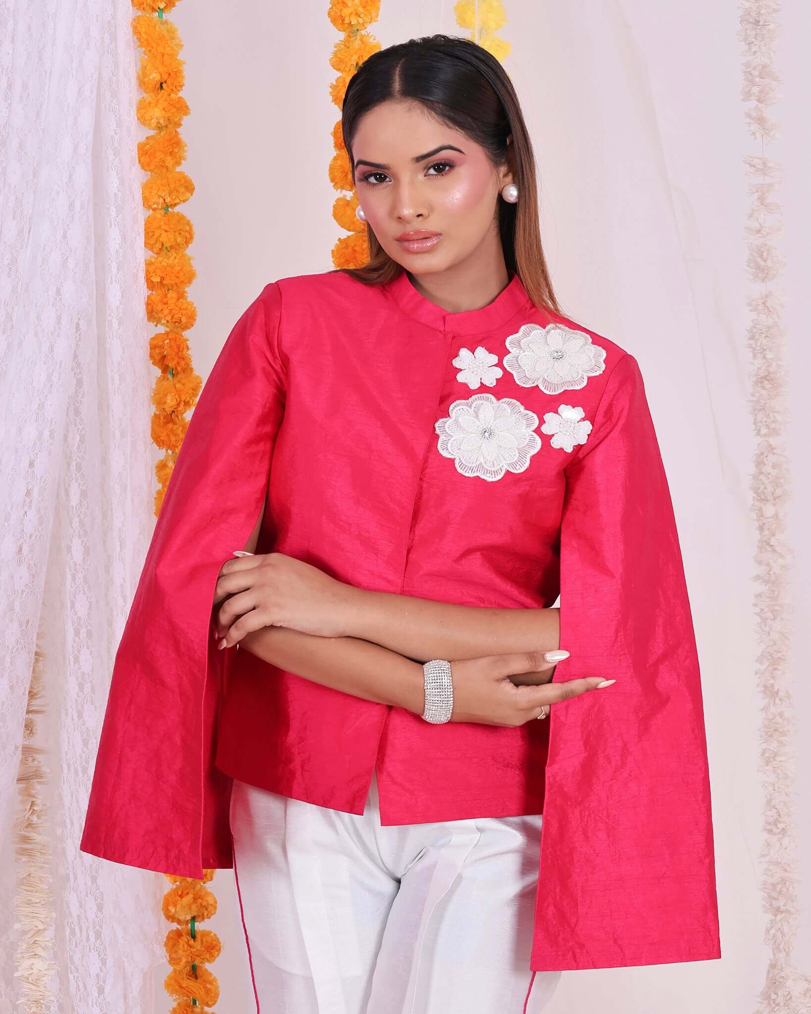 Stylish pink floral patch jacket and white pants set for women, perfect for festive occasions and elegant gatherings.