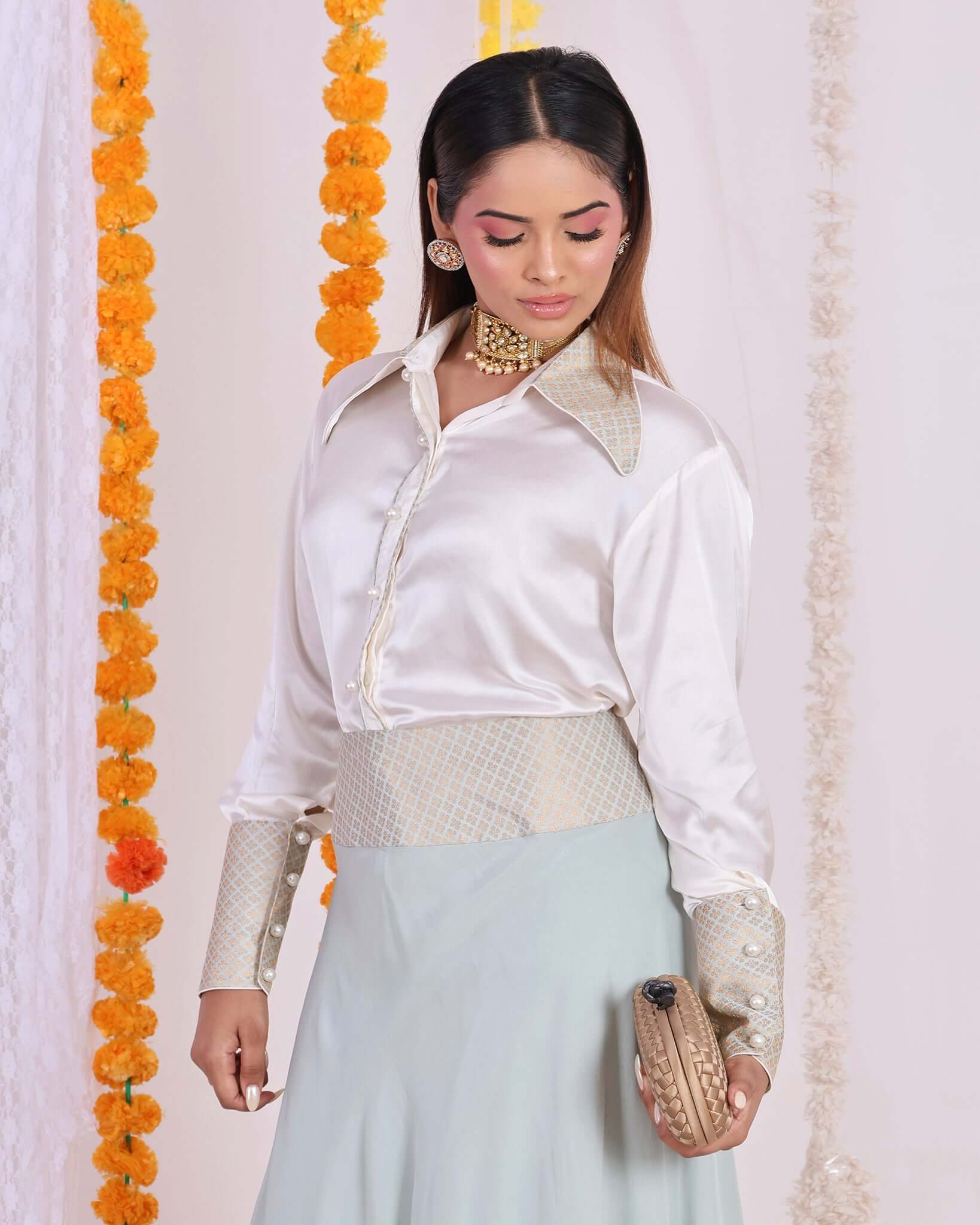 Convey elegance with this ivory satin shirt and mint green brocade skirt coord set for women - a fusion of modern style and traditional charm.