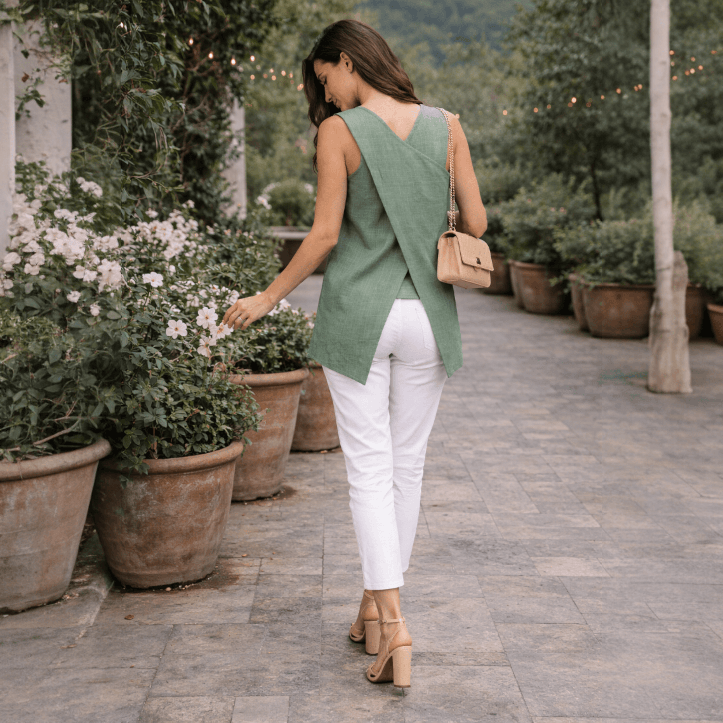 Model wearing Linen Co-Ord Set Green by House of Majisha – sleeveless green linen top with white pants, casual street style.