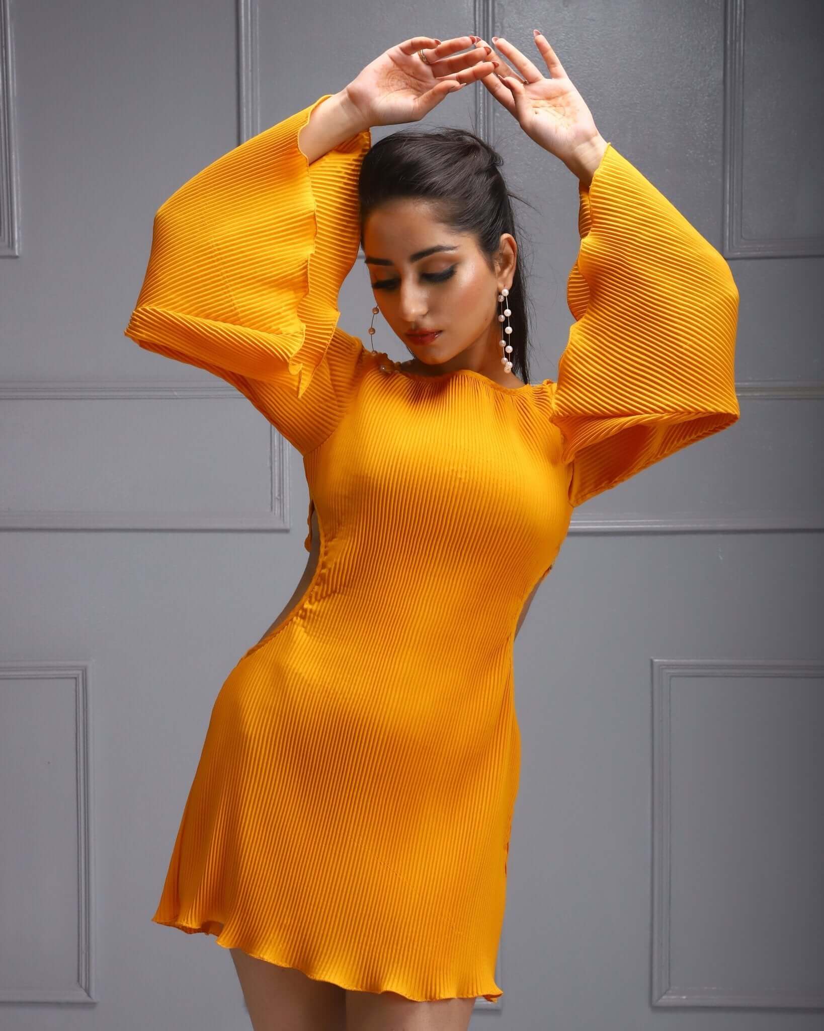 Make a statement in this yellow bell-sleeve dress with a chic side cut-out, combining elegance with modern flair.