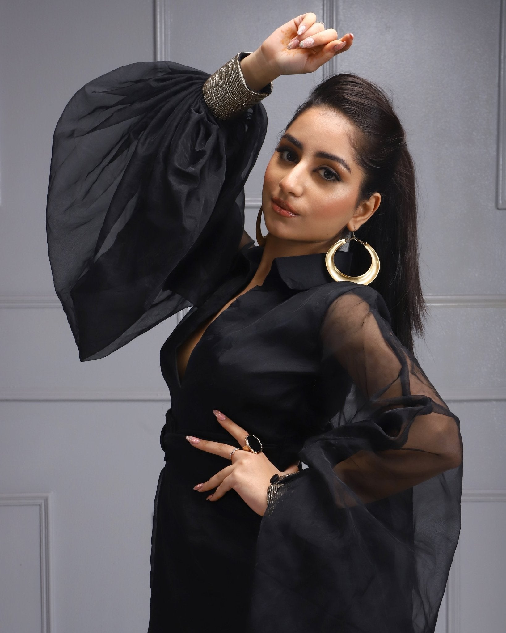 Black Sheer Dress - Elegant knee-length black dress with sheer puff sleeves, perfect for cocktail evenings and night parties.