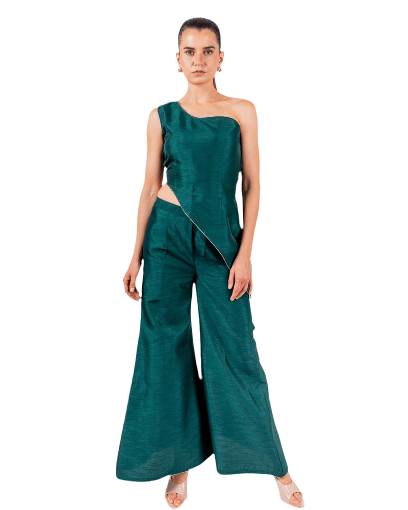 Emerald green coord set with off-shoulder asymmetrical top and flared palazzo pants, perfect for evening parties and clubwear sophistication