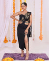 Black One-Shoulder Fusion Set: Elegant black one-shoulder fusion set with gold foil work, cut-out waist detail, and high slit skirt for a modern and glamorous look.