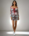 Model showcasing the Charming Print Dress in red and white floral design from House Of Majisha, featuring a sweetheart neckline and bow detailing, perfect for casual outings and parties