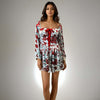 Featuring a sweetheart neckline and bow detailing, perfect for casual outings and parties, Model showcasing the Charming Print Dress in red and white floral design from House Of Majisha.