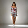 Featuring a sweetheart neckline and bow detailing, perfect for casual outings and parties, Model showcasing the Charming Print Dress in red and white floral design from House Of Majisha.