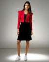 Model showcasing the Chic Fusion Dress by House Of Majisha, featuring a fuchsia pink jacket with silver piping over a sleek black tube dress, perfect for party wear.