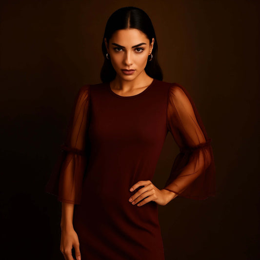 model wearing a Maroon Sheer Sleeve Mini Dress with sheer layered bell sleeves, styled by House of Majisha against a warm studio brown backdrop.