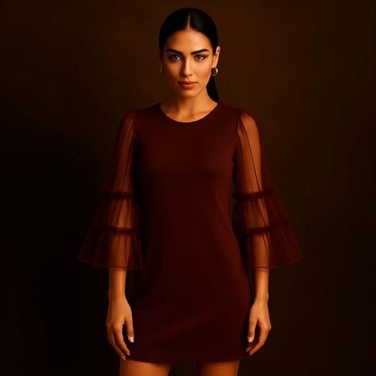 model wearing a Maroon Sheer Sleeve Mini Dress with sheer layered bell sleeves, styled by House of Majisha against a warm studio brown backdrop.