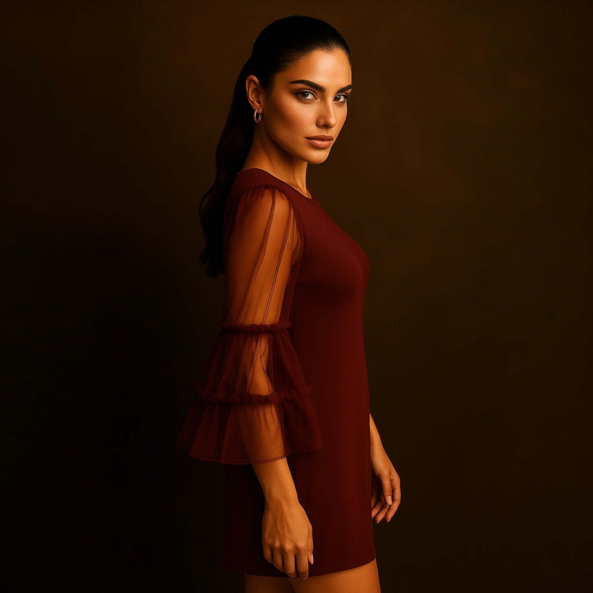 model wearing a Maroon Sheer Sleeve Mini Dress with sheer layered bell sleeves, styled by House of Majisha against a warm studio brown backdrop.
