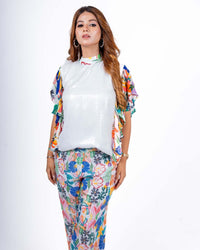 Vibrant white sequin coord set with playful floral print, ideal for a breezy summer day or casual outing.