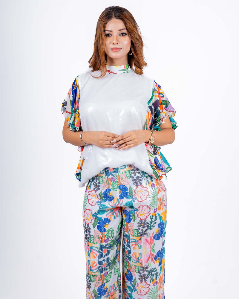 Vibrant white Sequin Coord Set with playful floral print, perfect for a breezy summer day or casual outing.