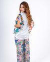 Vibrant white sequin coord set with playful floral print, perfect for a breezy summer day or casual outing.