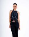 Model wearing black halter top with fringe details and backless design, perfect for parties and nights out.