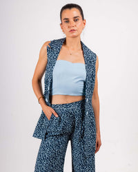 Elevate your look with this trendy outfit, featuring a light blue tube top and a matching printed vest and pants. The abstract design adds a unique touch, perfect for making a statement.