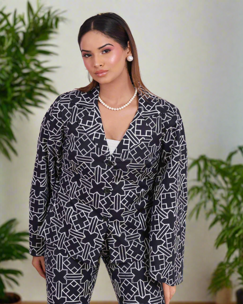 Dark blue embroidered fusion wear set for women featuring intricate thread work, bell sleeves, and tailored pants - a perfect blend of traditional craftsmanship and modern style.