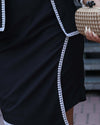 Elegant black formal co-ord set for women, featuring a structured black jacket with white lace detailing and a matching asymmetrical hemline skirt. Perfect for formal occasions or special gatherings.