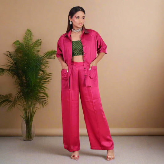 Vibrant Fuchsia Pink Satin Coord Set for Women - Featuring a stylish oversized shirt with brocade accents, wide-legged pants, and a green brocade crop top. Perfect for festive and party wear.