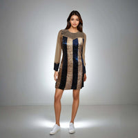 Model showcasing the Glamour Glitter Dress in rose gold and blue sequins from House Of Majisha, featuring net detailing on the neckline, perfect for parties and clubbing.