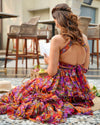 A vibrant multicolor chiffon halter neck dress with ruffles and a flared design from House Of Majisha, perfect for picnics, brunches, or vacation, featuring a backless style and full-length flowy silhouette.