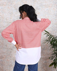 Woman wearing a red stripe cotton shirt with ruffled sleeves, from House Of Majisha. Trendy, casual summer fashion for ladies.