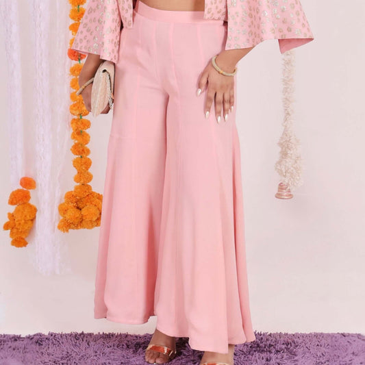 Stylish Peach Flared Pants for Women - Lightweight georgette fabric in peach color, wide-leg design, high-waisted, perfect for festive and casual occasions.