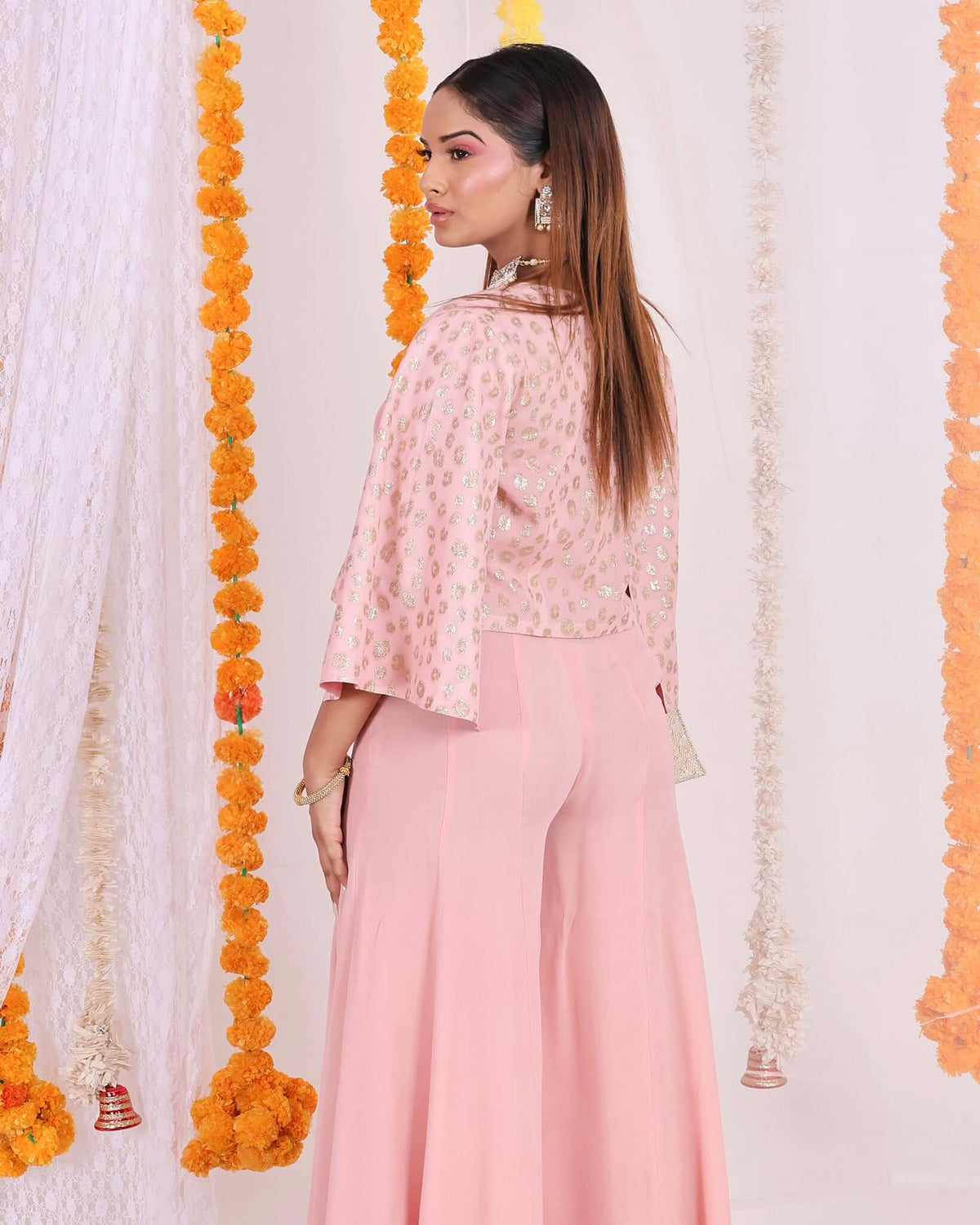 Stylish Peach Flared Pants for Women - Lightweight georgette fabric in peach color, wide-leg design, high-waisted for a sophisticated look.