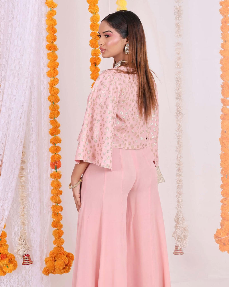 Stylish Peach Flared Pants for Women - Lightweight georgette fabric in peach color, wide-leg design, high-waisted for a sophisticated look.