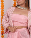 Elegant pink Banarasi Georgette Coord Set for women, featuring a stylish crop jacket with gold motifs, a matching tube top, and dhoti-style pants. Perfect for festive and party occasions, blending modern and traditional elements seamlessly.