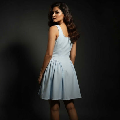 South Asian model wearing a Powder Bloom Fit Flare Dress with sleeveless design and flowing skirt, styled by House of Majisha against a dark studio backdrop.