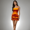 Model showcasing the Ruffle Radiance Dress in vibrant orange satin with ruffle detailing at the bottom from House Of Majisha, ideal for parties and brunch outings.