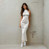 Women Standing And Posing For A Camera Wearing A Chic Satin Mermaid Dress From House Of Majisha.