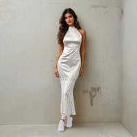 Women Standing And Posing For A Camera Wearing A Chic Satin Mermaid Dress From House Of Majisha.