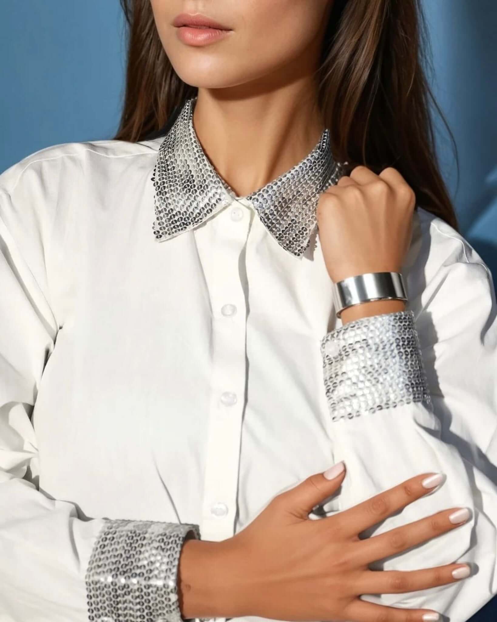 Close-up of Sequin Collar on White Satin Shirt, A detailed view of the silver sequin-embellished collar on a chic white satin button-down shirt, perfect for an elegant and sophisticated look.