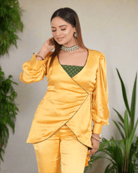 Yellow Armani Satin Wrap Coord Set for women - A modern fusion of yellow Armani satin and green brocade, featuring a flattering V-neckline, puffy sleeves, and tailored fit with tie-up detail.