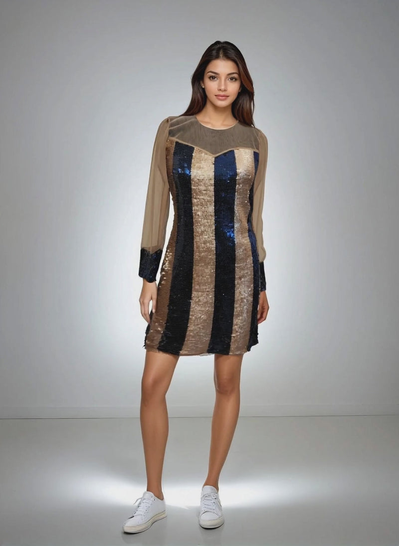 Model showcasing the Glamour Glitter Dress in rose gold and blue sequins from House Of Majisha, featuring net detailing on the neckline, perfect for parties and clubbing.