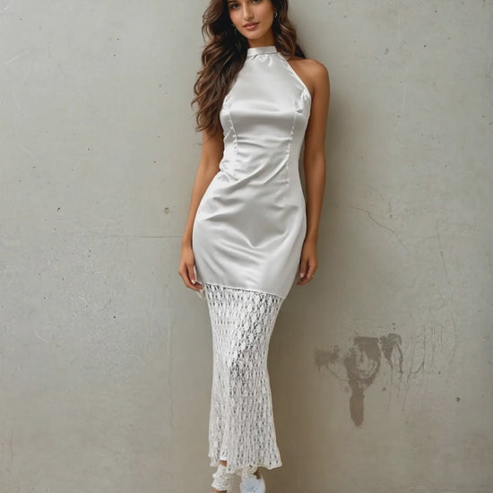 Women Posing For A Camera Wearing A Chic Satin Mermaid Dress From House Of Majisha.