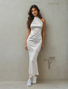 Women Posing For A Camera Wearing A Chic Satin Mermaid Dress From House Of Majisha.