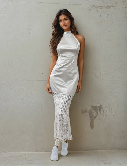 Women Posing For A Camera Wearing A Chic Satin Mermaid Dress From House Of Majisha.