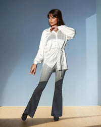 Model wearing elegant white satin shirt with drawstring waist and voluminous sleeves from House Of Majisha