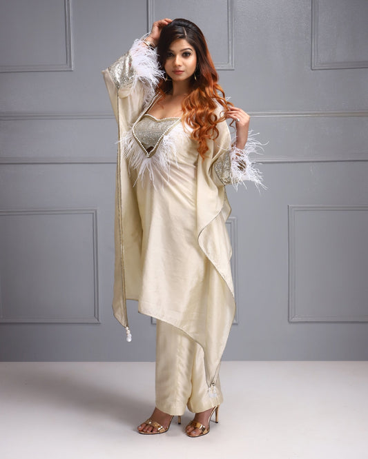 House Of Majisha Luxe Silk Kaftan Ensemble - Cream silk kaftan with sequined bustier and feathery accents, perfect for sophisticated parties and festive occasions.
